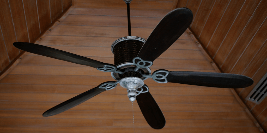 ceiling fan hanging from a wood ceiling