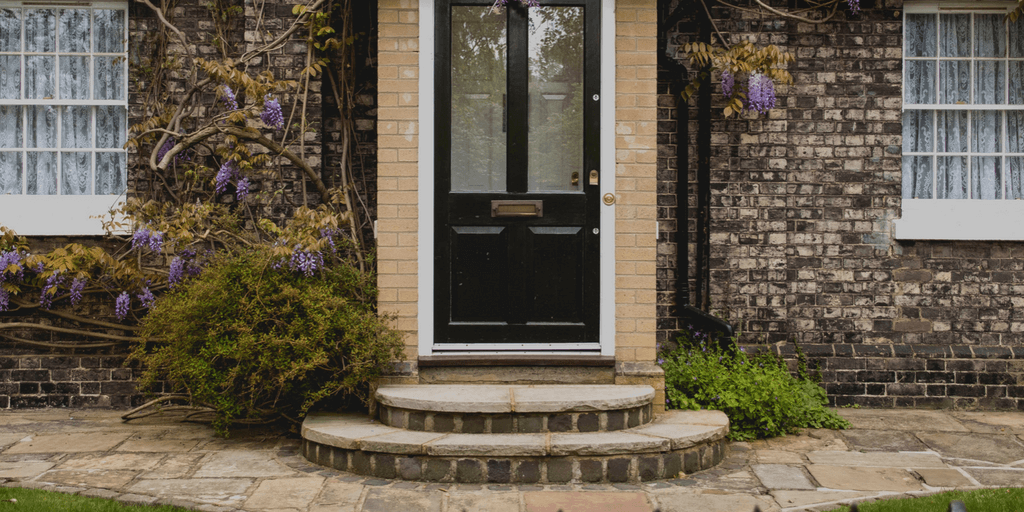 the front door of a brick house