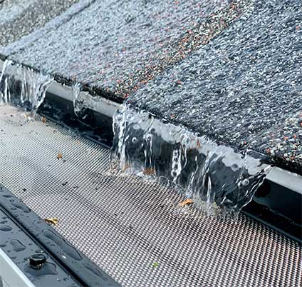 Gutter guard system performing in winter conditions with ice formation in Chicago climate